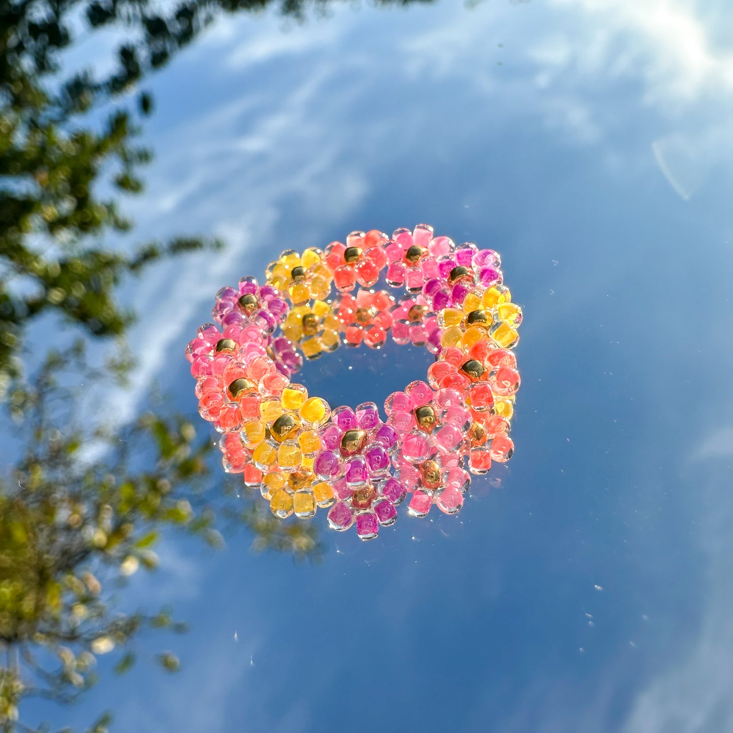 Blumenring "Milly" aus Glasperlen in Lila, Pink, Orange und Gelb
