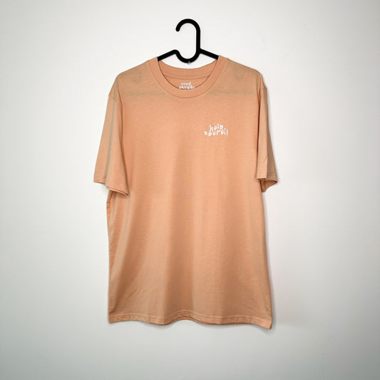 Unisex T-Shirt in Apricot mit Stick „Holy Aperoli“